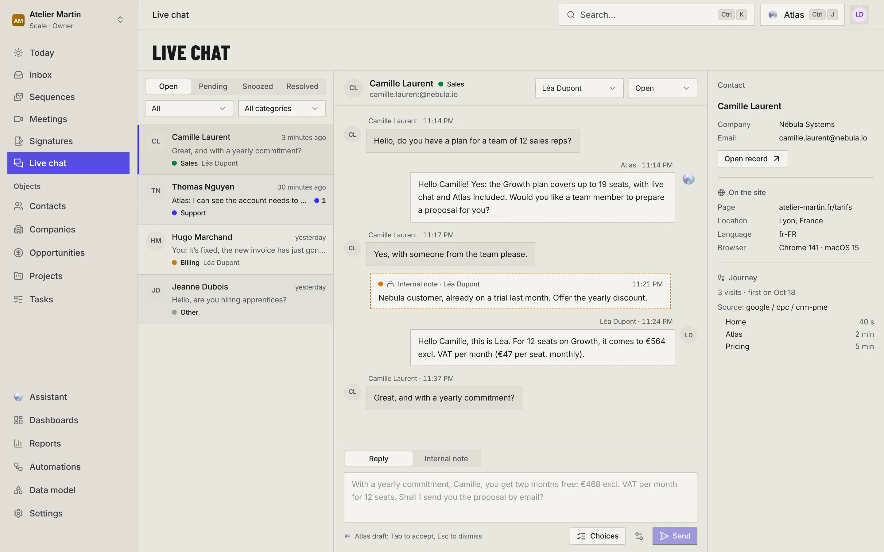 The live chat inbox: the list of open conversations with their filters, the conversation with Camille Laurent (Atlas' messages, an internal note, the team's reply), Atlas' draft in the composer, and the contact's record with their journey on the website.