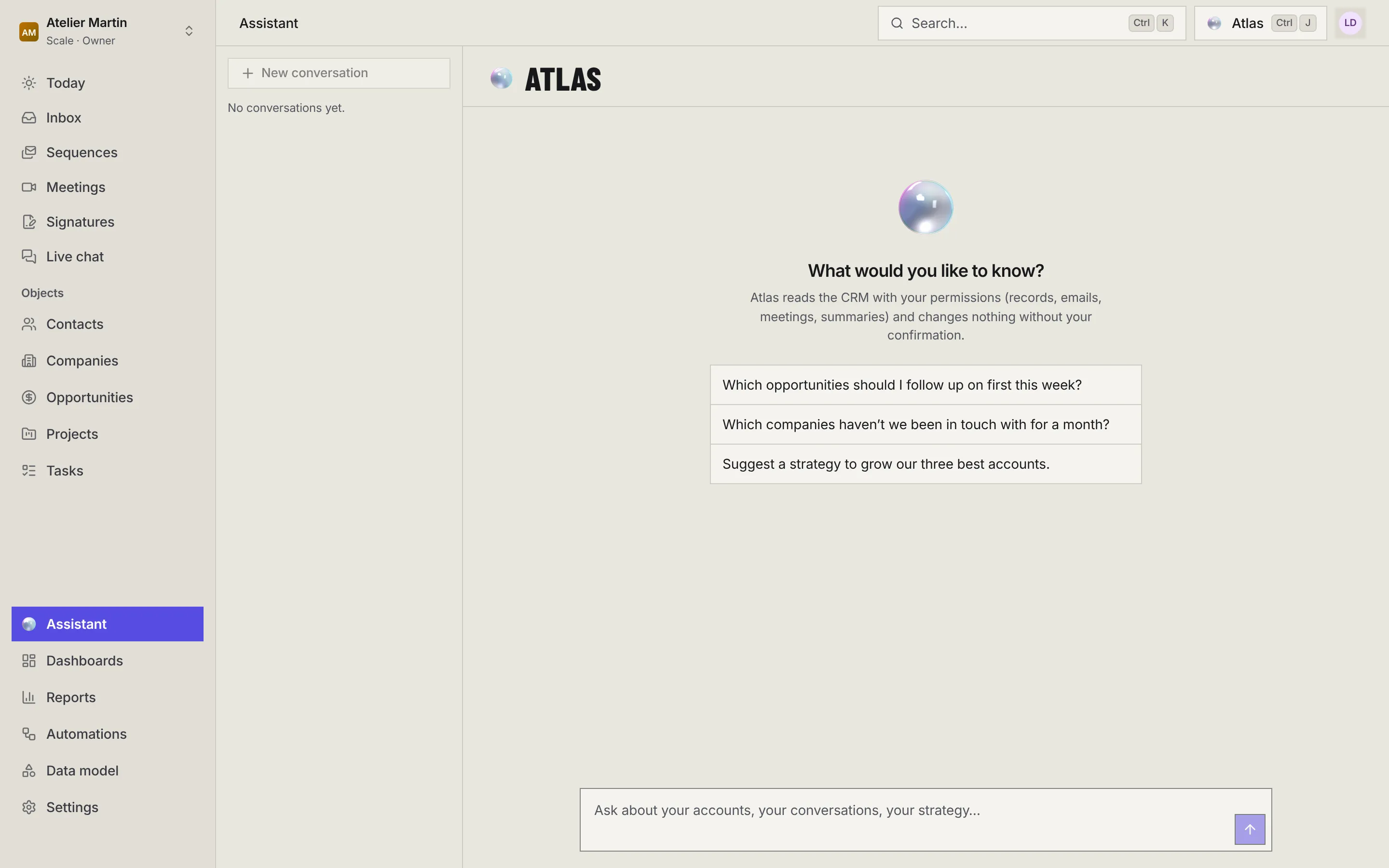 The Assistant page: New conversation and the conversation list on the left, the Atlas orb, What would you like to know?, three suggested questions and the input box.